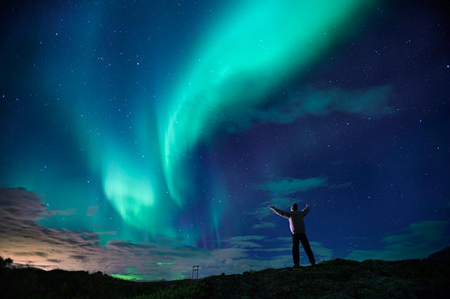 A night hike to see the Northern Lights is a breathtaking way to get some exercise while on holiday.